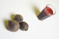 Glass of freshbeetroot smoothie on table, next to red beetroot herb Royalty Free Stock Photo