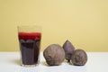 Glass of freshbeetroot smoothie on table, next to red beetroot herb Royalty Free Stock Photo