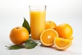 glass of freshly squeezed orange juice with orange