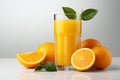 glass of freshly squeezed orange juice with orange