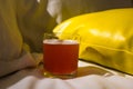 A glass of fruit beer on bed Royalty Free Stock Photo