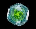 Glass geometric orb with glowing green core and angular translucent facets Royalty Free Stock Photo