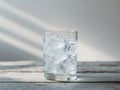 Glass gin tonic wooden table is filled ice A. Royalty Free Stock Photo