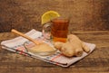 Glass of ginger tea with honey and lemon