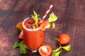 glass glass of tomato juice with fresh bright tomatoes, green parsley