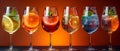 Glass glasses with different drinks on a bright background