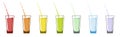 Glass glasses with drinks of different colors. A rainbow colored liquid pours out
