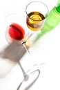 Glass glasses with drinks of different colors on a white background. Top view. The concept of an alcoholic cocktail Royalty Free Stock Photo