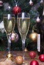 2 glass glasses with sparkling wine, a bottle of wine, wine, Golden, red, Christmas balls on the background of Christmas tree Royalty Free Stock Photo