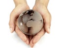 Glass globe in hands Royalty Free Stock Photo