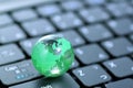 Glass globe over keyboard Royalty Free Stock Photo