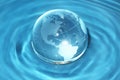 Glass globe in water Royalty Free Stock Photo