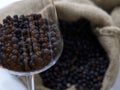 a glass goblet full of juniper berries Royalty Free Stock Photo