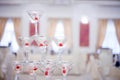 Glass goblets. Pyramid of champagne. The hill glasses wine and cherries. for alcohol. Festive drink. Bartender show Royalty Free Stock Photo