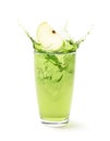 Glass of Green apple juice splash with sliced apple Royalty Free Stock Photo