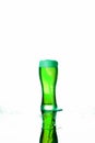 A glass of green beer with foam on a white background Concept: St. Patrick`s Day Royalty Free Stock Photo