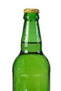 Glass green bottle with the declines of water on a white isolated background. Closeup Royalty Free Stock Photo