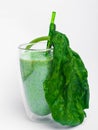 Glass with green health smoothie, kale leaves, lime, apple, kiwi, grapes, banana, avocado, lettuce spinach Copy space Raw, vegan, Royalty Free Stock Photo