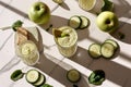 A glass of green juice with cucumber slices and a green apple Royalty Free Stock Photo