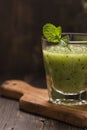 Glass of green refreshing smoothie with kiwi, cucumber and apple Royalty Free Stock Photo
