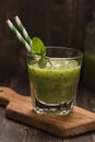 Glass of green refreshing smoothie with kiwi, cucumber and apple Royalty Free Stock Photo