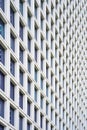 Glass grey square Windows of facade modern city business building skyscraper. Modern apartment buildings in new neighborhood. Royalty Free Stock Photo