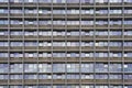 Glass grey square Windows of modern city business building skyscraper. Royalty Free Stock Photo