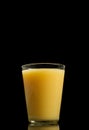 Glass of healthy fresh cold melon smoothies isolated on black background with copy space