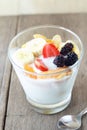 Glass of home made yogurt with cereals, strawberry, ban Royalty Free Stock Photo