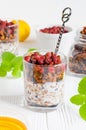 Glass of homemade granola with wild strawberries