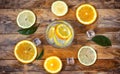 Glass homemade lemonade, orange, lemon, ice cube