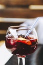 Glass of homemade sangria cocktail with fruits and ice cubes