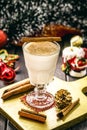 Glass of hot eggnog, Christmas drink, based on eggs, cinnamon, almonds and rum liqueur. called eggnog, milk and pisco, coquito or