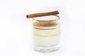 Glass of hot eggnog, Christmas drink, made with eggs, cinnamon, almonds and rum liqueur. Isolated white background and copy space Royalty Free Stock Photo