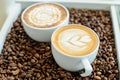 A glass of hot latte art coffee Royalty Free Stock Photo