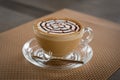 A glass of hot latte art coffee Royalty Free Stock Photo