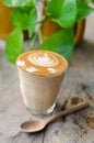 A glass of hot latte art coffee Royalty Free Stock Photo