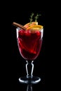 Glass of hot mulled wine isolated on black Royalty Free Stock Photo