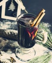 Glass hot Mulled wine with sticks of cinnamon, anise, lemon Royalty Free Stock Photo