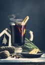 Glass hot Mulled wine with sticks of cinnamon, anise, lemon Royalty Free Stock Photo