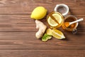 Glass with hot tea, lemon and ginger Royalty Free Stock Photo