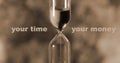 Glass hourglass is pouring out the sand expires time. Your time