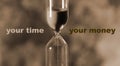 Glass hourglass is pouring out the sand expires time. Your time