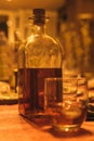 glass with ice and bottle of pacharan whiskey or cognac liqueur Royalty Free Stock Photo