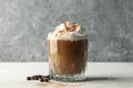 Glass ice coffee with poured cream on wooden table Royalty Free Stock Photo