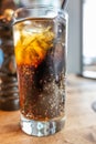 Glass of Ice cold cola drink with straw Royalty Free Stock Photo