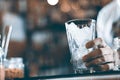 Glass with ice cubes on the background of the bar Royalty Free Stock Photo