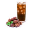 Glass of ice date tea and pile of dates palm fruit Royalty Free Stock Photo