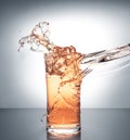 Glass with ice and liquid splash Royalty Free Stock Photo