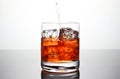 Glass with ice and liquor splash Royalty Free Stock Photo